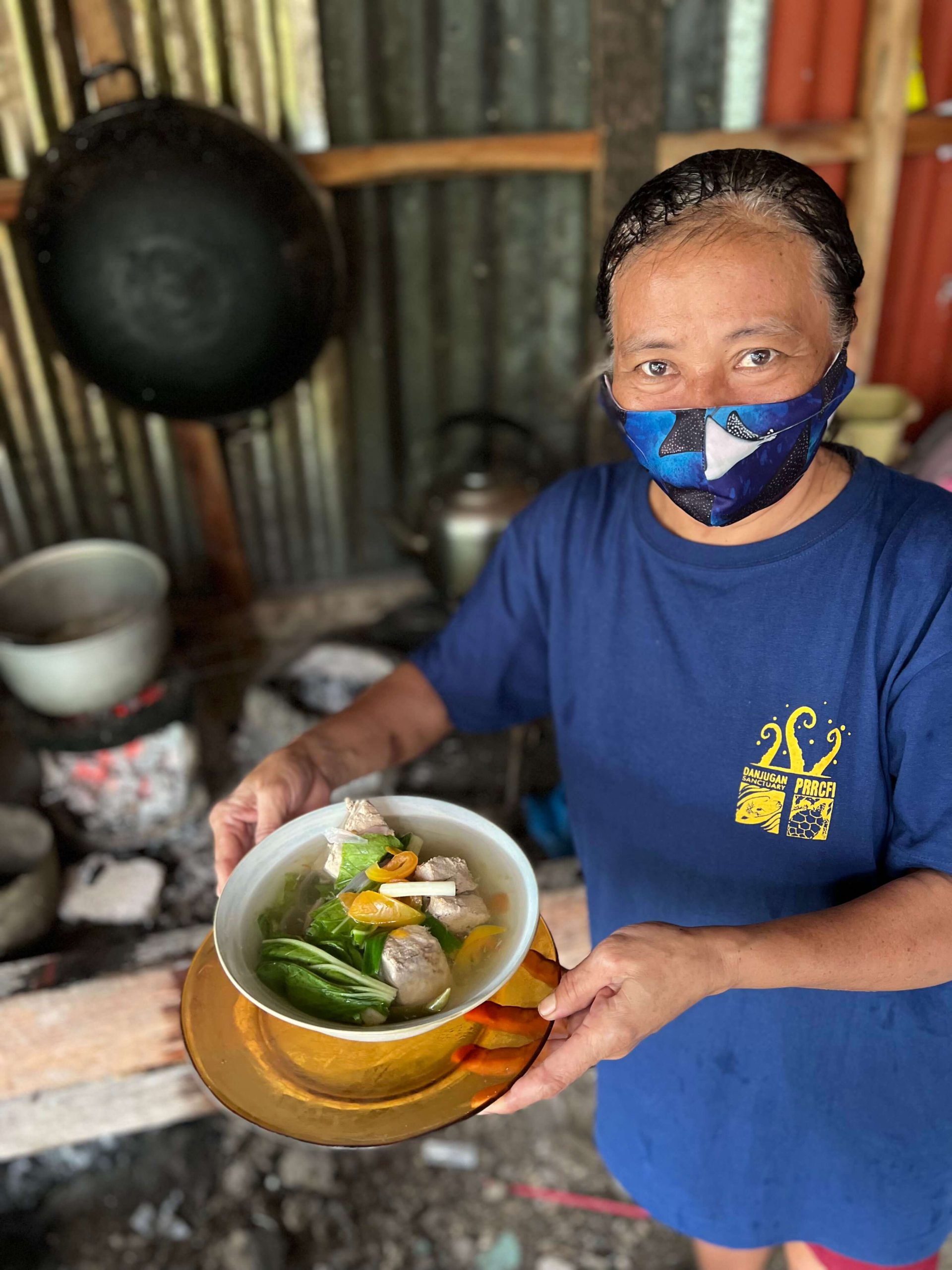 Daday, Danjugan island’s chef, shows off one of her delicacies, a traditional Filipino soup called Tinola. Food on the island is always locally sourced or produced