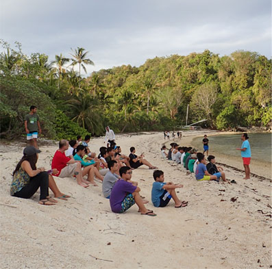 Sunset is always a wonderful time on Danjugan Island. Here, young people take a moment to pause and reflect during their marine and wildlife camp