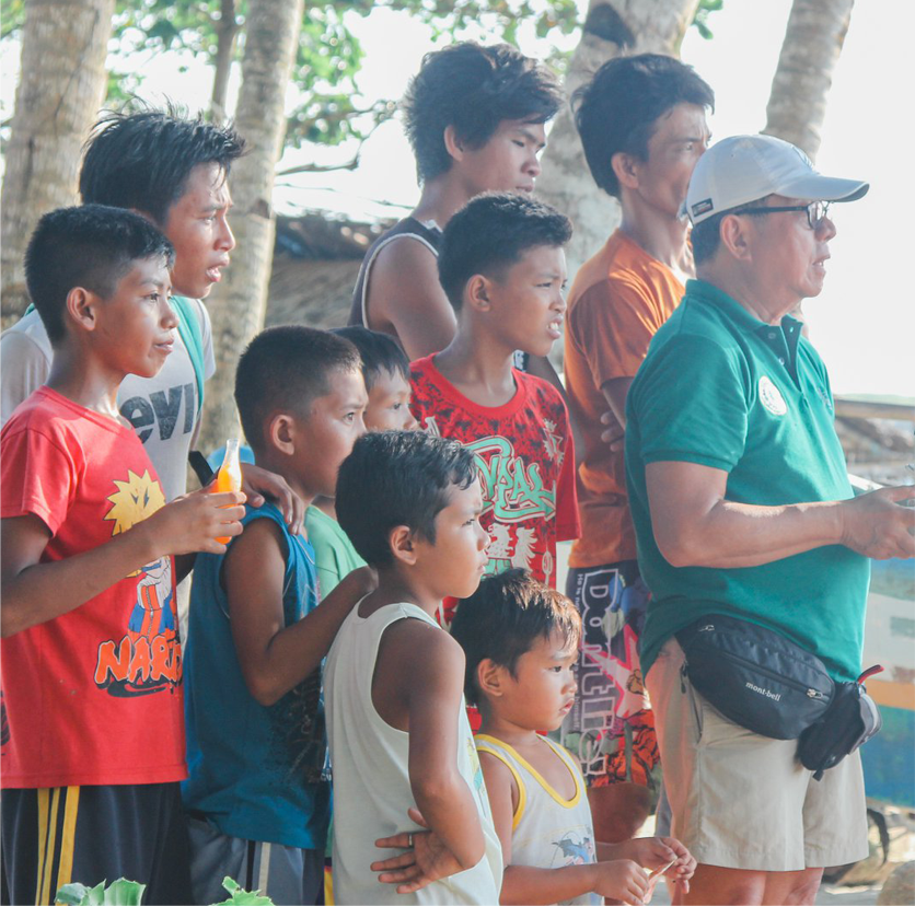Philippine environmental champion Gerry Ledesma joins the youth of Barangay Bulata, a local village on Danjugan Island